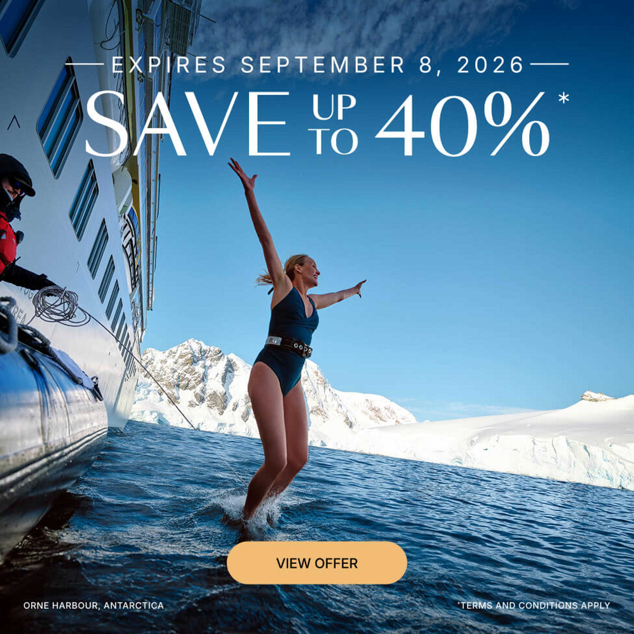 A woman jumps into the water in Antarctica with text promoting a 40% discount.