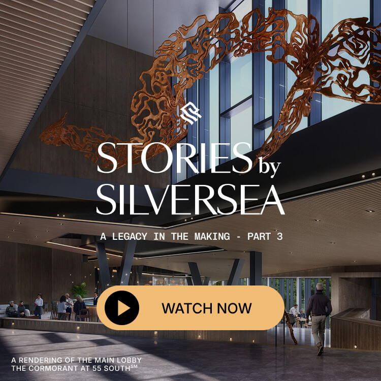 Rendering of a modern luxury hotel lobby with an abstract sculpture and people at a bar.